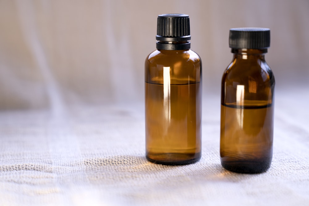 a couple of brown bottles sitting on top of a table