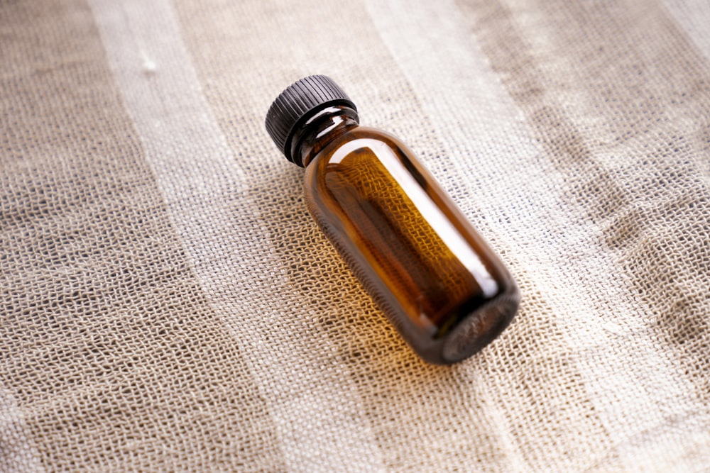 a brown bottle sitting on top of a table