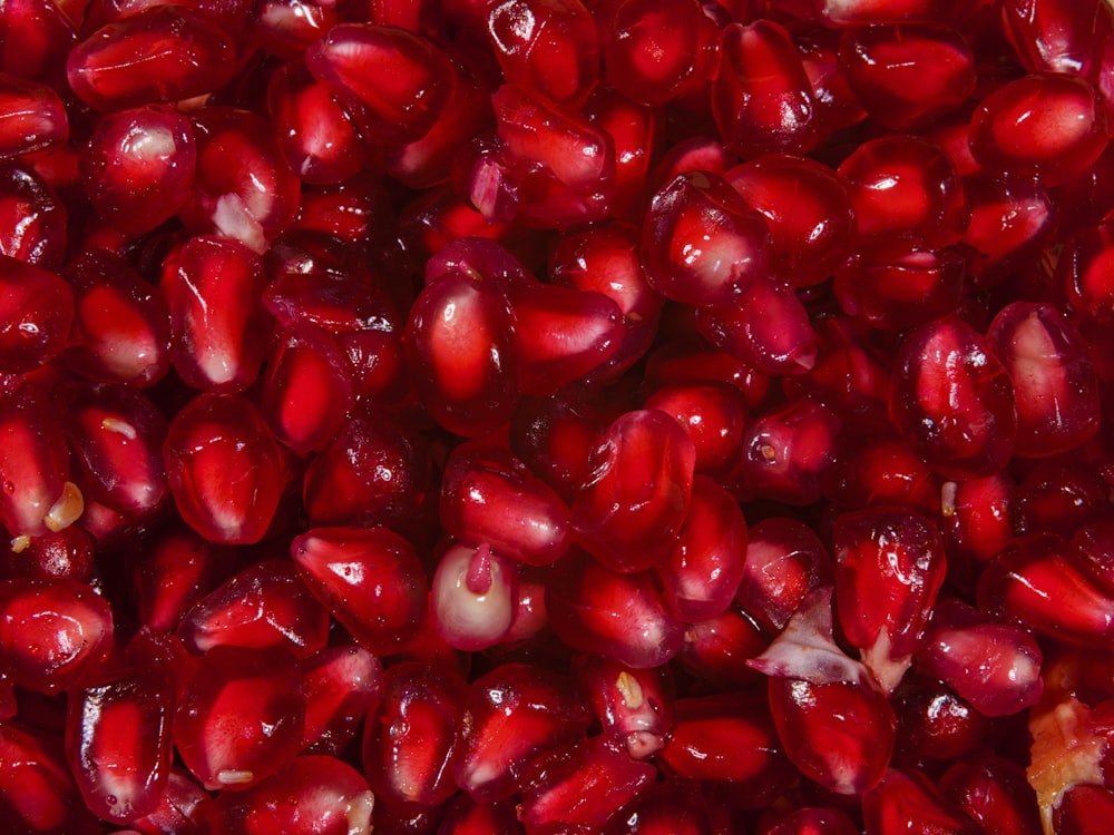 a close up of a bunch of pomegranates