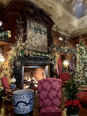 a living room decorated for christmas with a fireplace