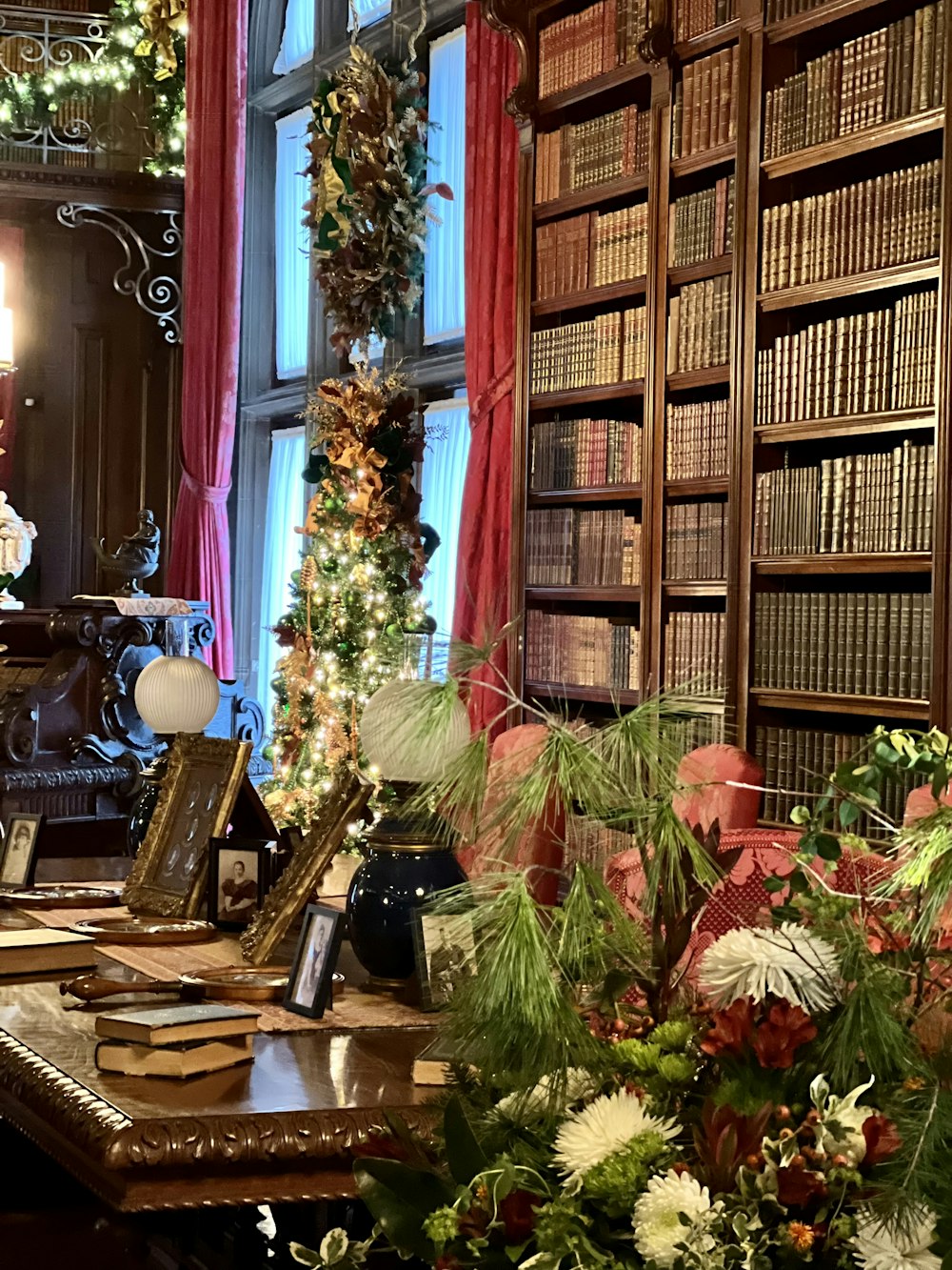 a room filled with lots of books and flowers