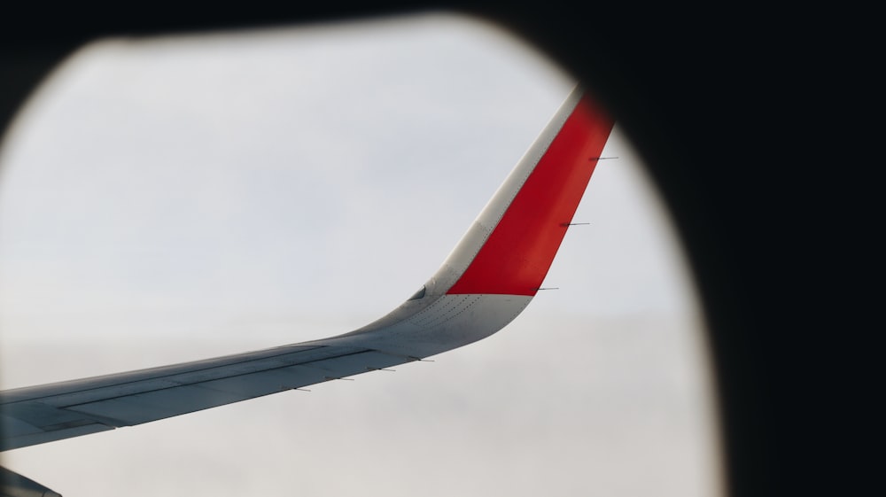 a view of the wing of an airplane through a window