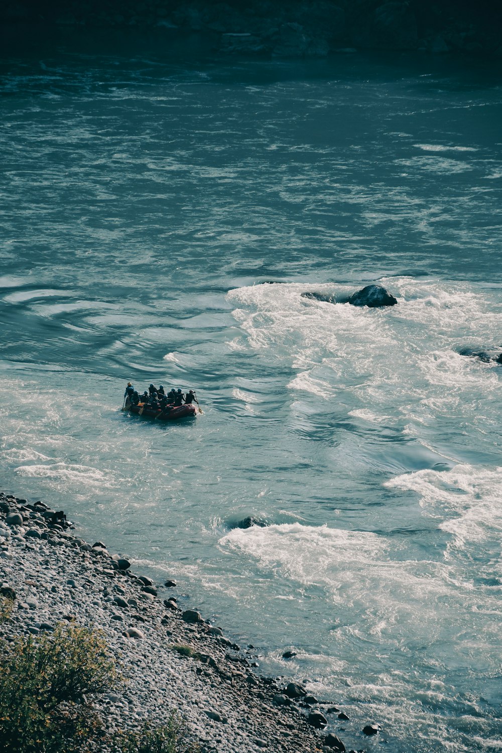 a group of people floating on top of a body of water