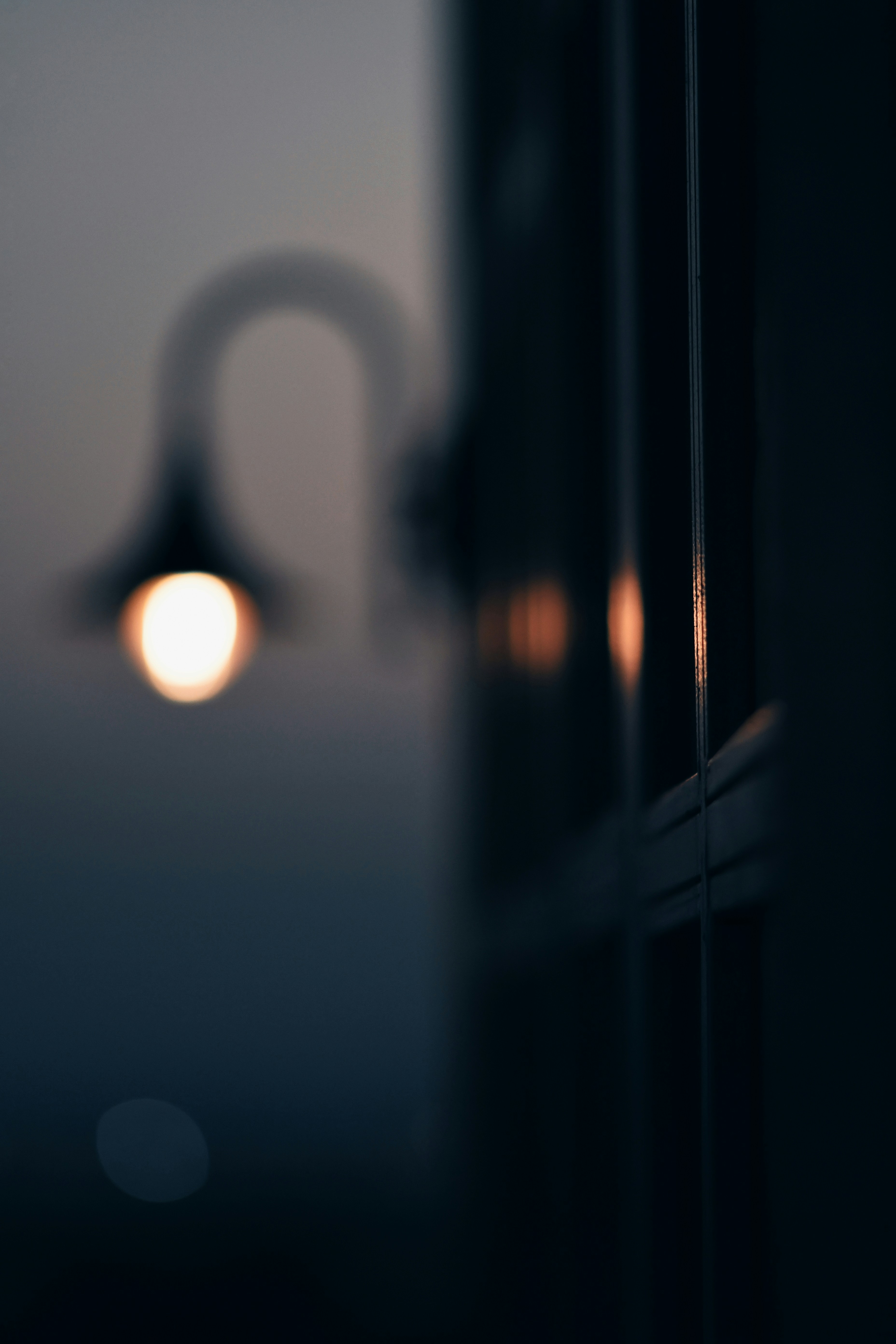 a street light is seen through a window