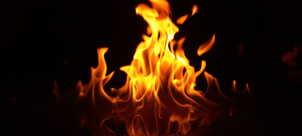 a close up of a fire in the dark