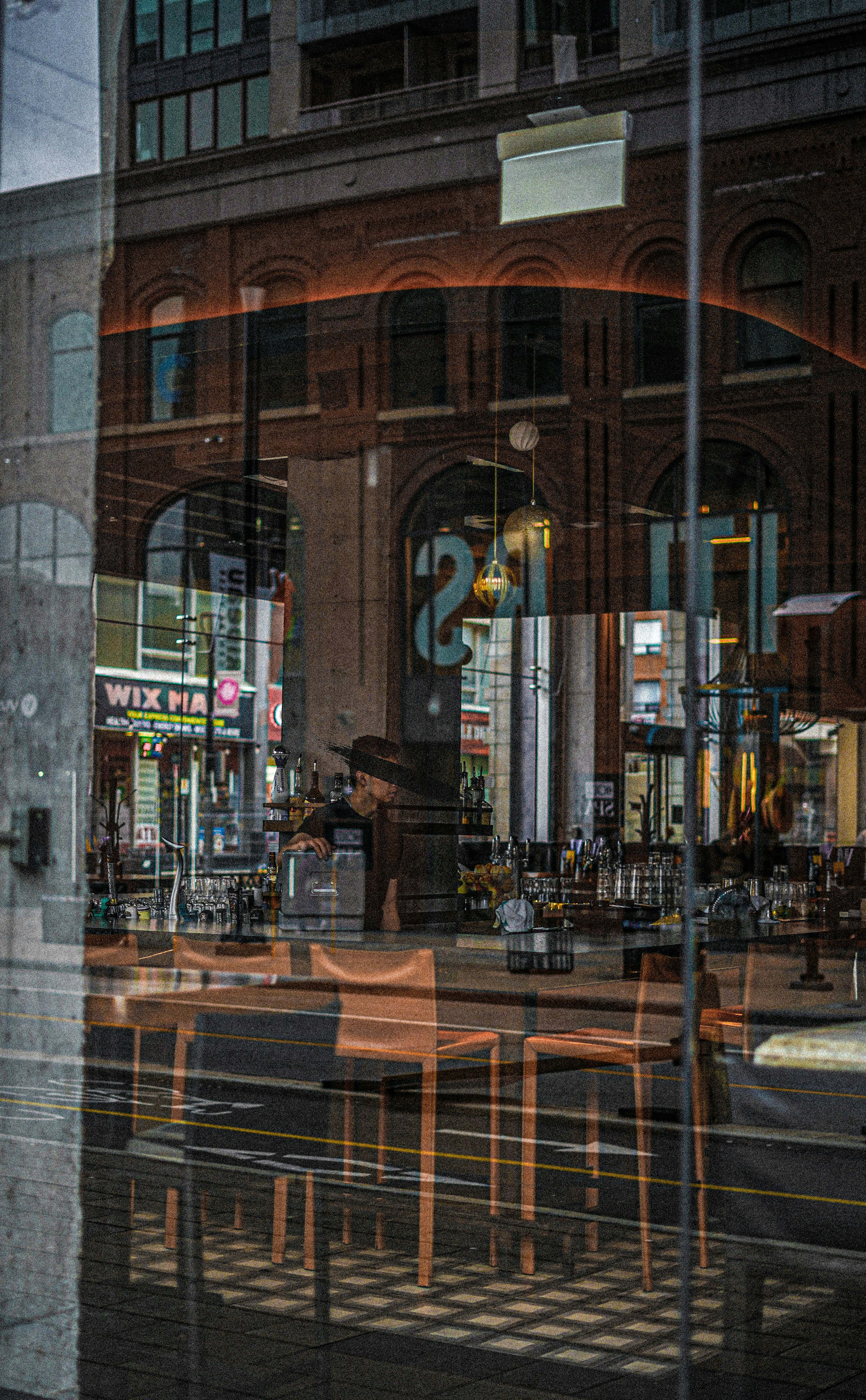a reflection of a restaurant in a window