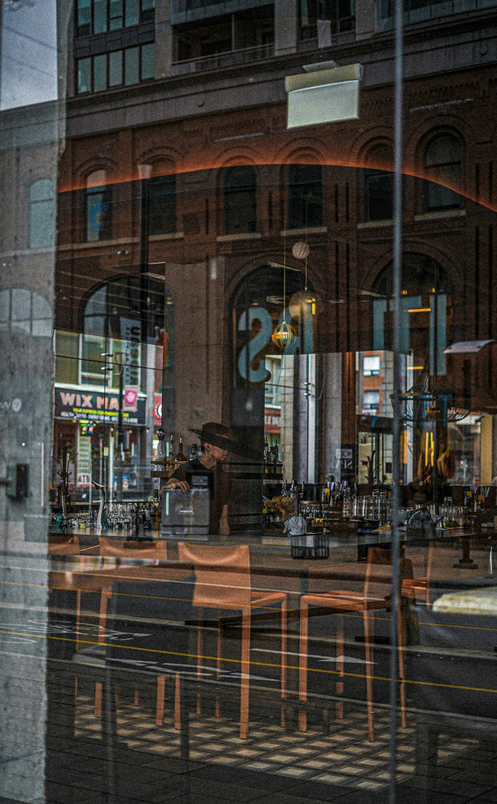 a reflection of a restaurant in a window