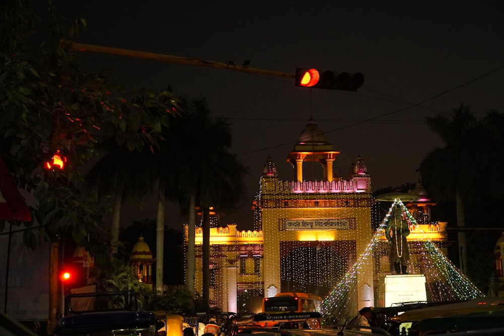 a traffic light hanging over a street filled with traffic