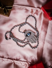 A customer happily receiving their custom eye pendant package at home.