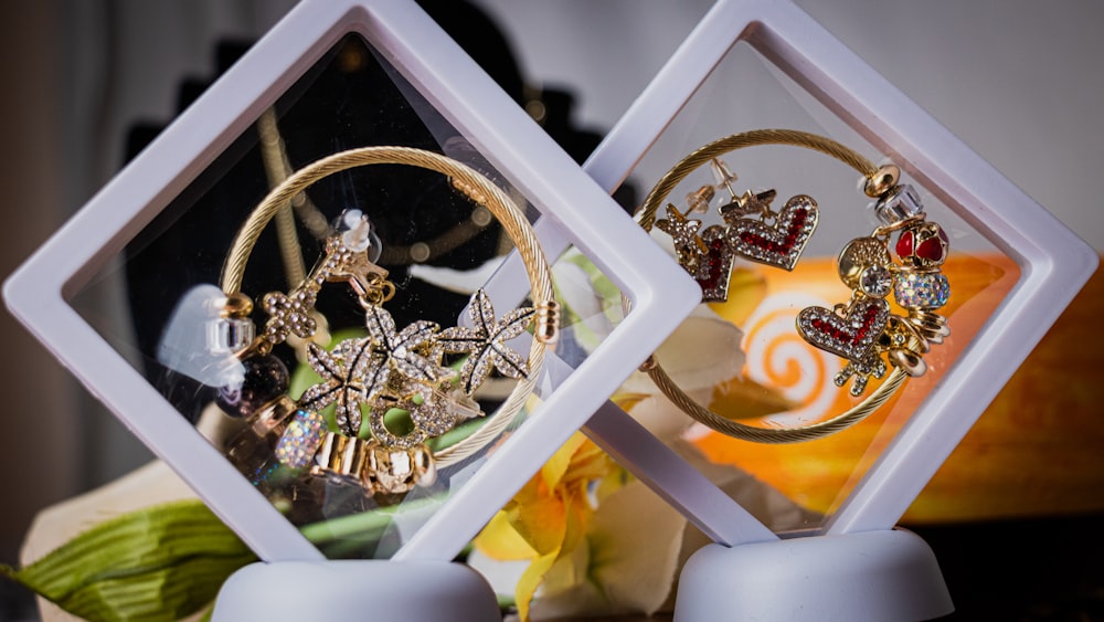 a pair of earrings sitting on top of a table