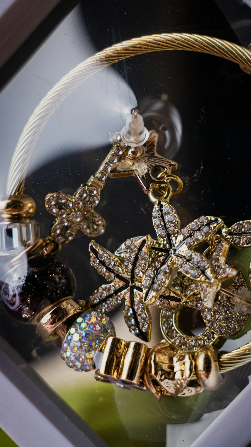 a close up of a bunch of jewelry on a table