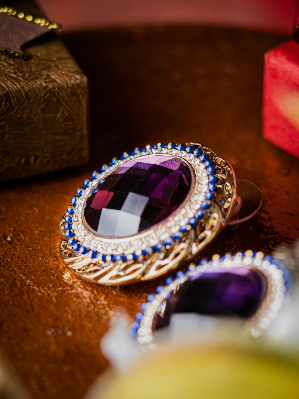 a close up of a pair of earrings on a table