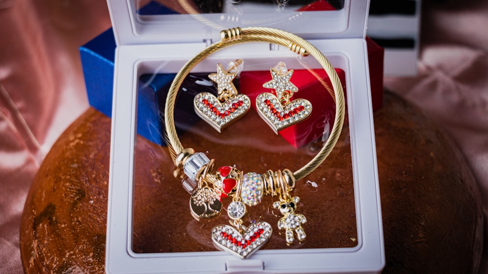 a set of jewelry in a box on a table