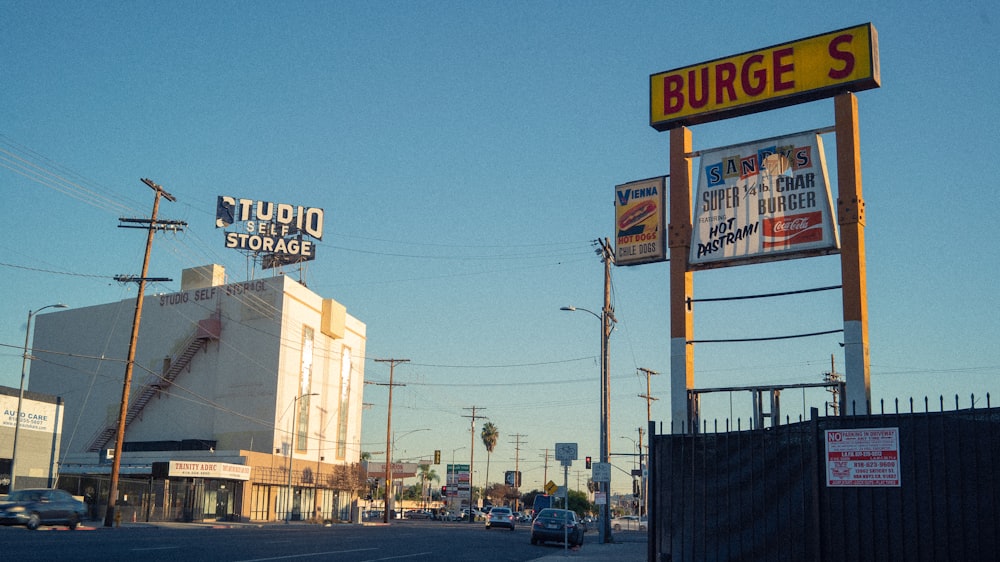 a street with a bunch of signs on the side of it