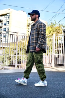 A candid shot of a man walking outdoors in a stylish jacket from the brand's sustainable line.