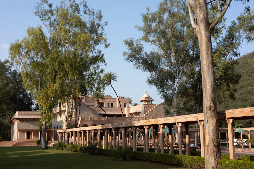 a large building with a lot of trees in front of it