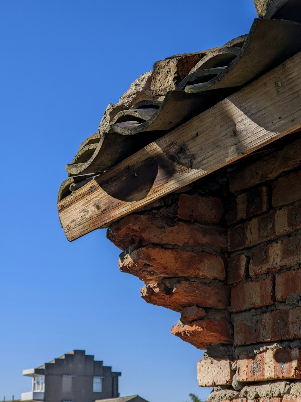 a close up of a brick chimney with a sky background