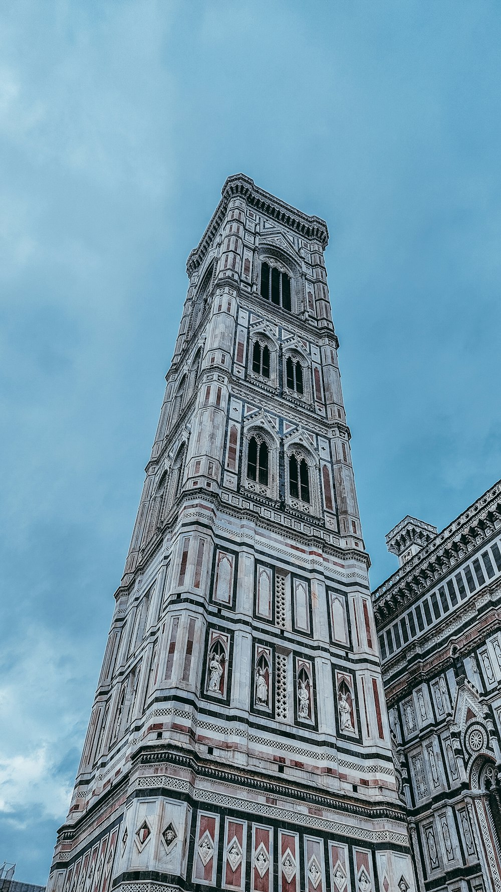 a tall tower with a clock on the top of it