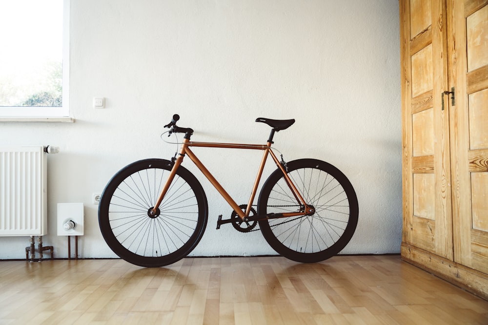 a bike leaning against a wall in a room