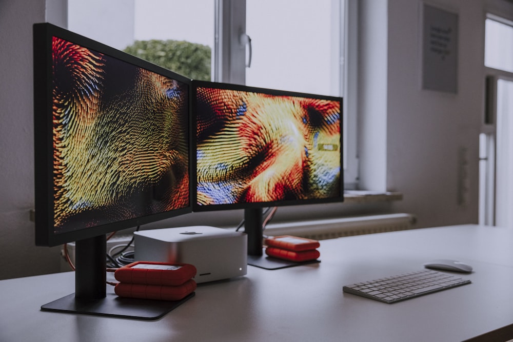 a computer monitor sitting on top of a desk