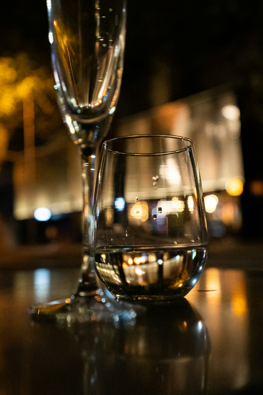 a couple of wine glasses sitting on top of a table