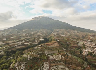 a view of a city below a mountain