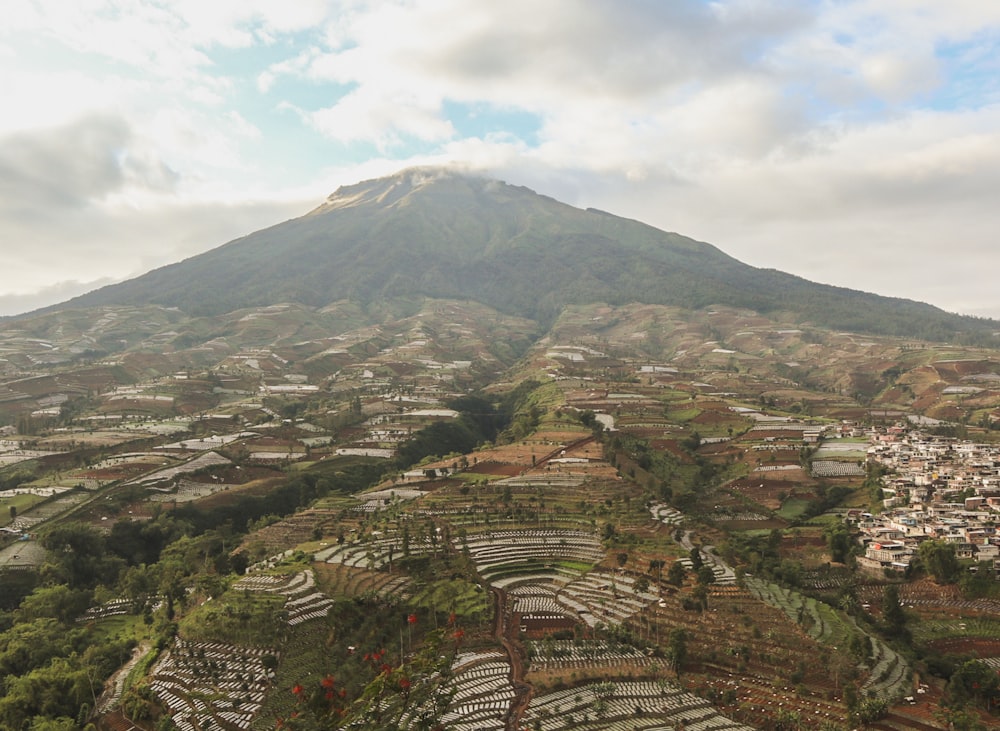 a view of a city below a mountain