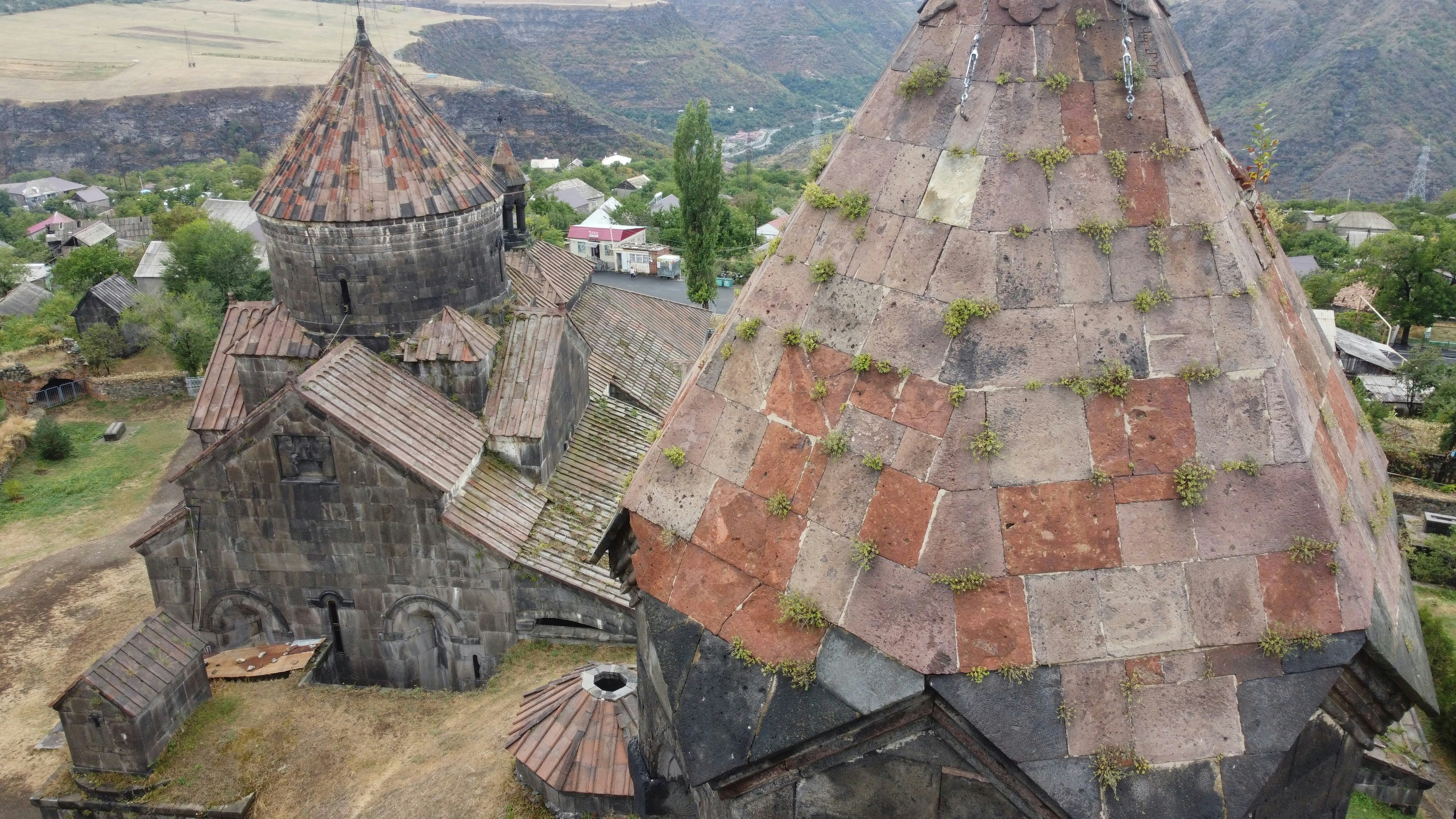 an aerial view of an old church in the mountains (Photo by Pau de Valencia on Unsplash)