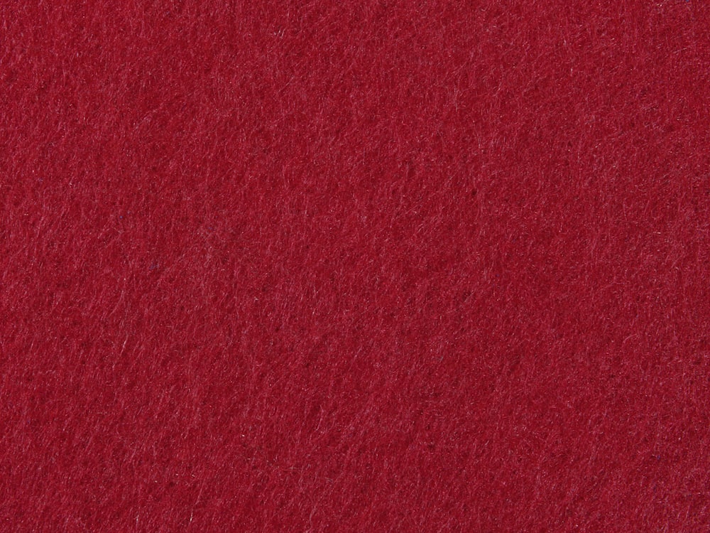 a close up of a red felt texture