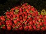 a pile of strawberries sitting on top of each other