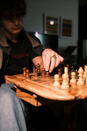 a man is playing a game of chess