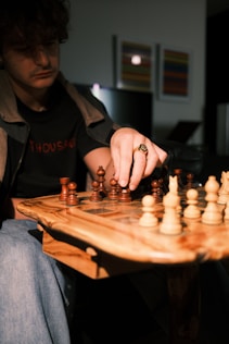 a man is playing a game of chess