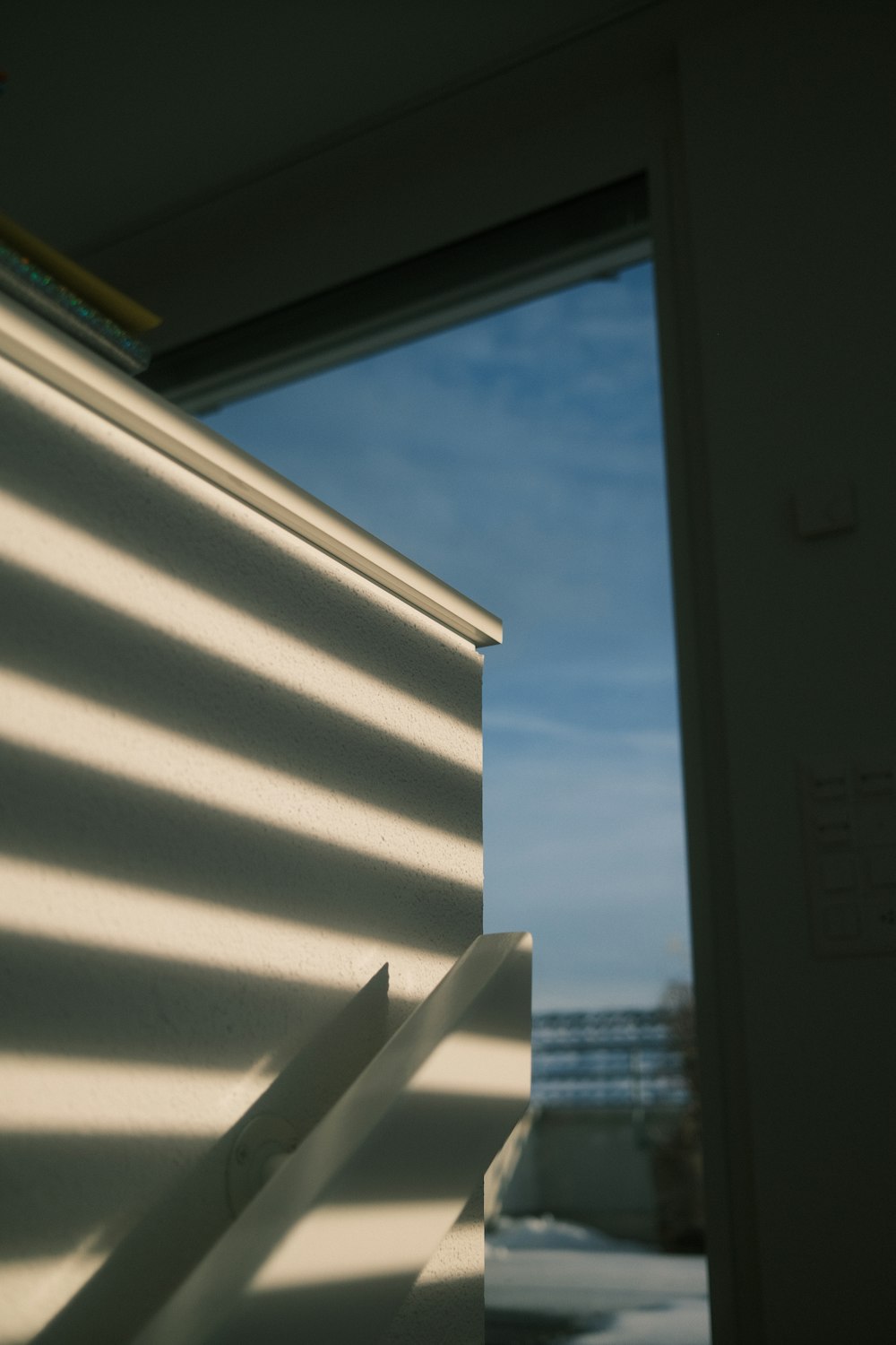 a close up of a window with a sky background