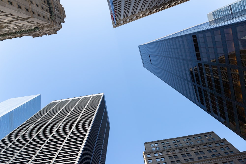 looking up at tall buildings in a city