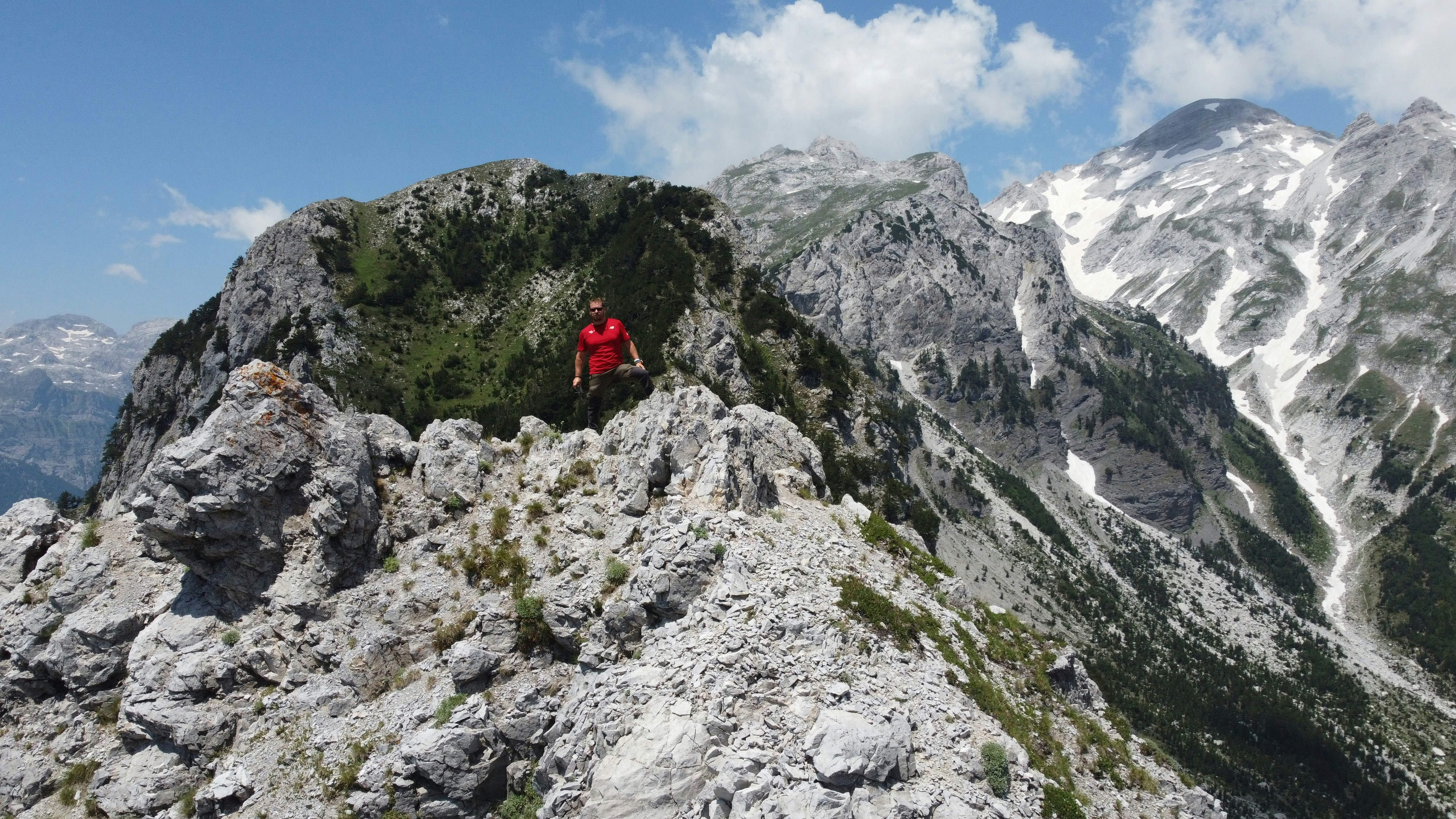 a man standing on top of a rocky mountain