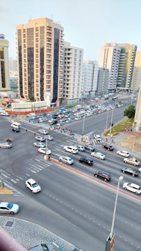 An adult driver confidently navigating a city intersection during their road test.