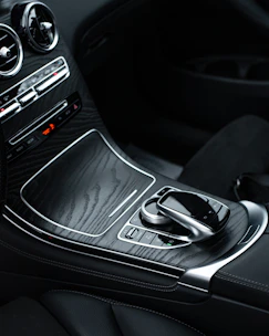 Sleek CarPlay compatible device displayed on a polished car console.