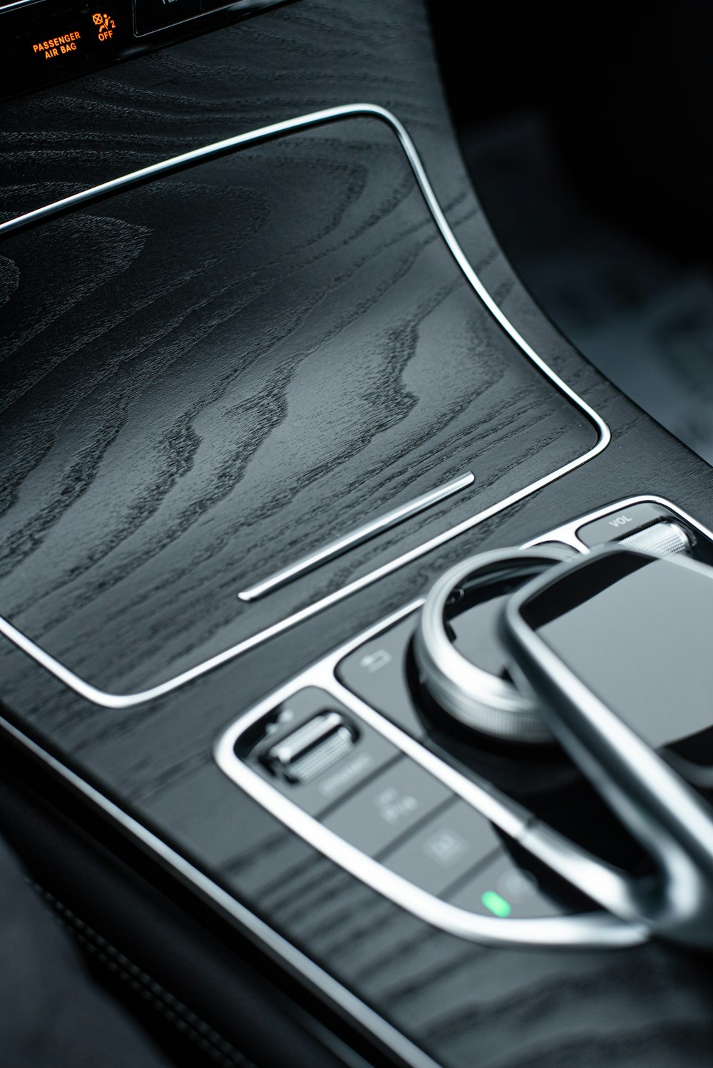 a close up of a cell phone in a car