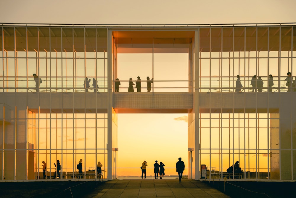 a group of people standing on top of a tall building