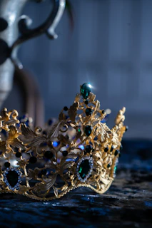 Spotlight shining on the crown resting on a velvet cushion, symbolizing prestige and achievement.