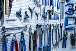 a bunch of tools hanging on a wall