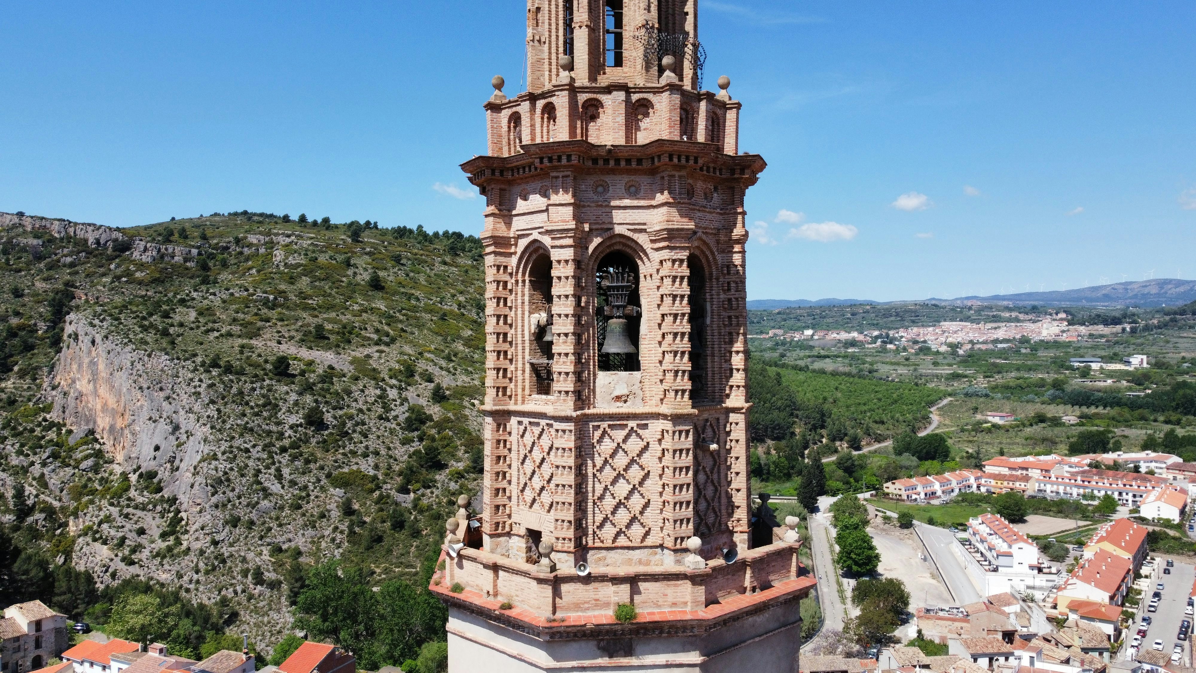 a tall tower with a clock on the top of it