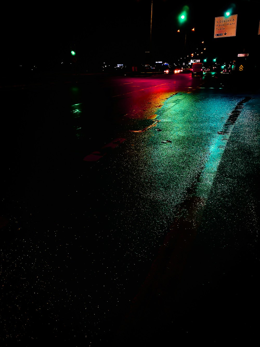 a street at night with a traffic light