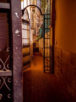 an open door leading to a building with a clock on it