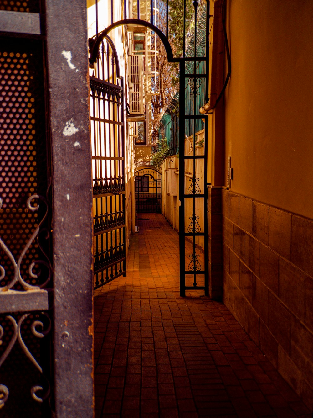 an open door leading to a building with a clock on it