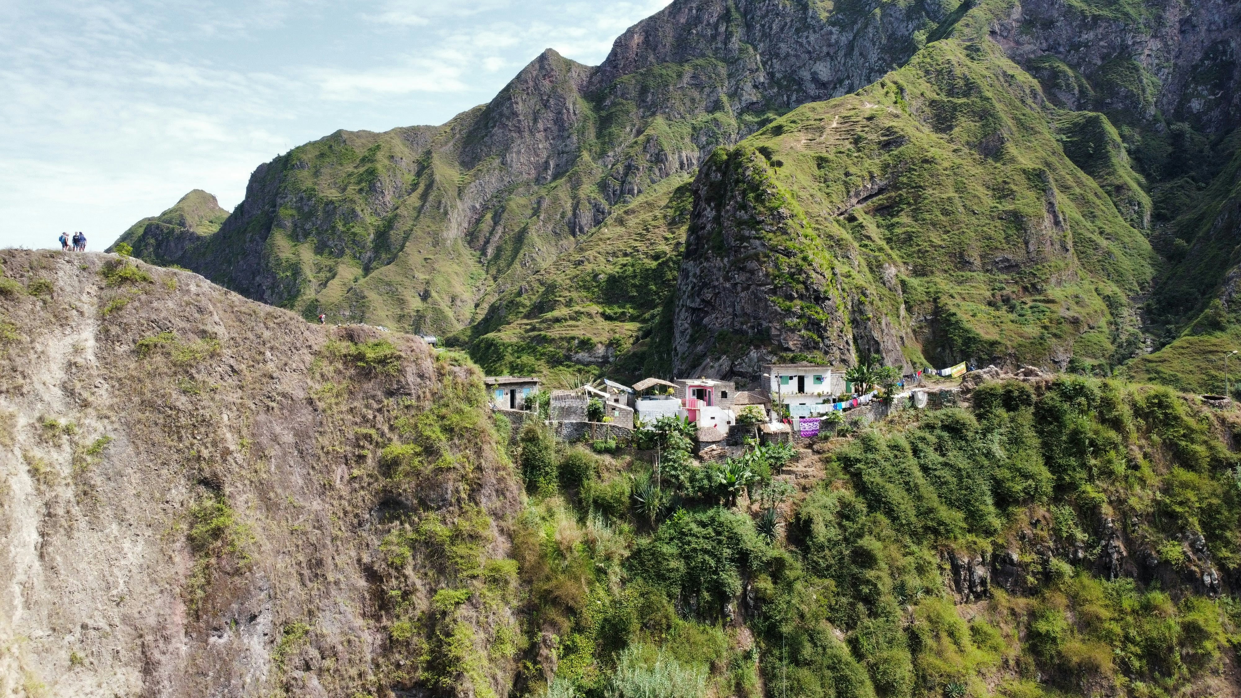 a group of people standing on top of a mountain