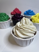 A colorful assortment of cupcakes with swirled frosting and sprinkles.