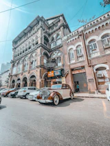 A vintage car outside a Colaba building