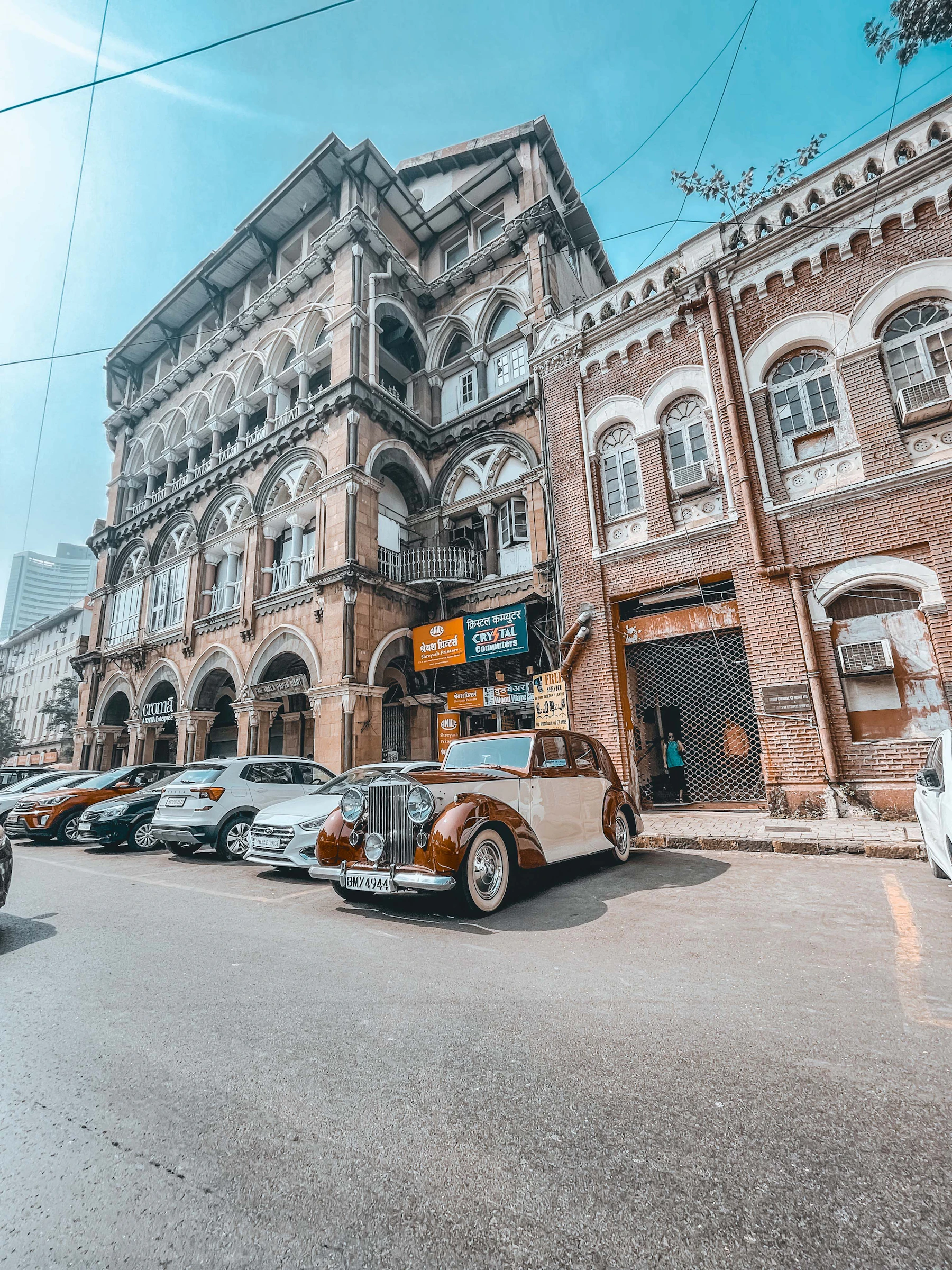 A vintage car outside a Colaba building