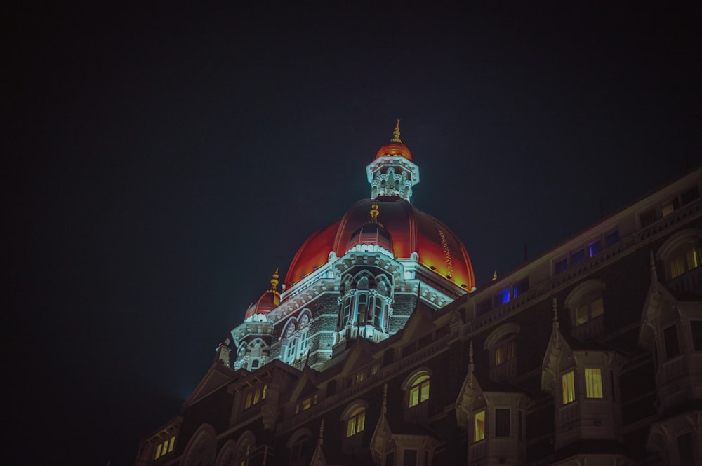 a large building with a lit up dome at night